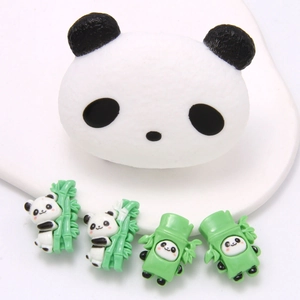 Detail showing cute panda resin charms for shoes including climbing and bamboo designs