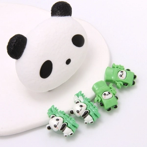 Detail view of cute panda and bamboo resin shoe charms for DIY clog decoration