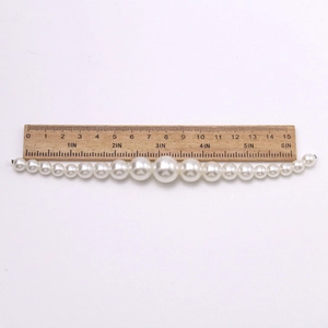 Close-up of DIY faux pearl chain for shoes with measurement showing 16cm length