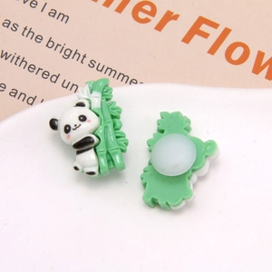 Front and back detail of cute 3D resin panda shoe charms for clogs with green bamboo