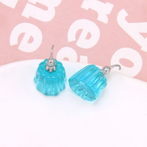 Close-up of blue jelly pudding earrings with transparent resin and silver hooks