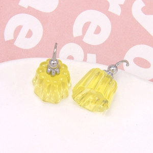 Macro view of yellow jelly pudding earring charms with vertical ribbed resin texture