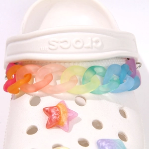 Detail of matte rainbow chain and gradient star charm accessories for clog shoes