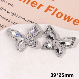 Detailed view of silver butterfly shoe charm with sparkling rhinestones, 39x25mm size