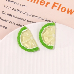 Detailed macro of vibrant resin lemon slice charms for DIY jewelry and crafts
