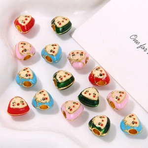 DIY enamel zongzi lucky charms in four colors on a white heart tray for jewelry making
