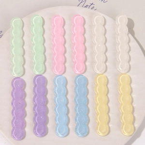 Vista superior de accesorios para el cabello de resina en forma de onda con purpurina en seis colores