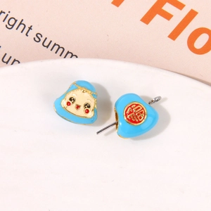 Macro view of blue enamel charm beads with baby face and lucky Fu character for DIY jewelry