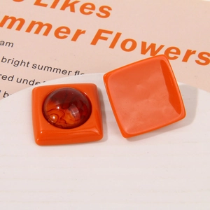 Detail of square orange resin earrings with amber center inlay for DIY jewelry making