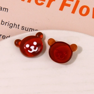 Macro shot of amber translucent resin bear charms for DIY jewelry and accessories