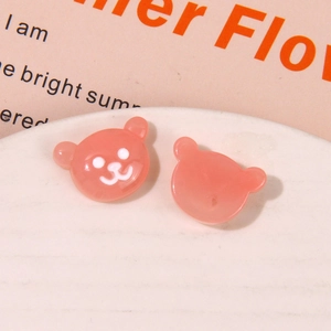 Detail of pink resin bear charm showing front and flat back for DIY crafts jewelry making