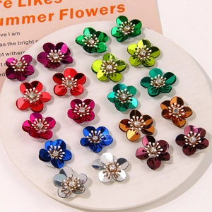 Vibrant floral sequins with Aurora coral finish and rhinestone center for DIY crafts