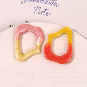 Macro view of gradient glitter resin hollow rings for DIY jewelry accessories