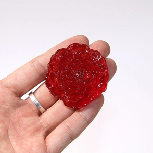 Large translucent red resin daisy flower accessory with 3D multilayered petals design