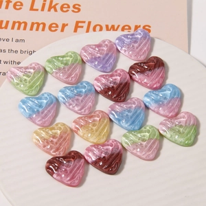 Glittery heart resin charms with gradient pearlescent finish for DIY hair accessories