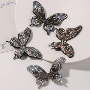 Close-up of butterfly rhinestone patches in four colors for DIY hair accessories