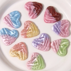 Pearlescent heart-shaped resin charms with radial texture and glitter for DIY crafts