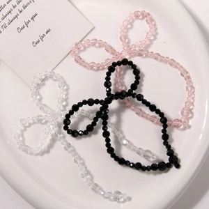 Handmade beaded bow accessories in pink, black, and clear crystal for DIY hair clips