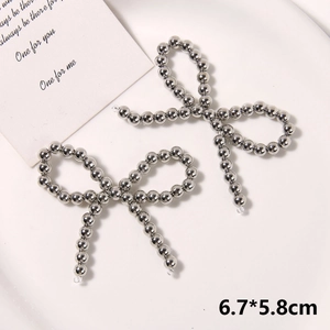Detail of handcrafted silver metallic bead bow accessories for DIY clog shoes 6.7x5.8cm