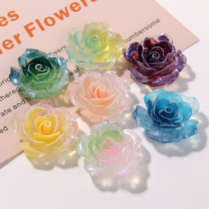 Close-up of DIY resin blue roses with glitter powder for hair accessories and shoe charms