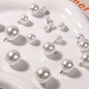 Lustrous white faux pearl charms with silver eyelet hooks for DIY jewelry in multiple sizes