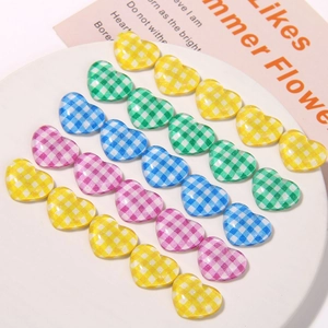 24 pieces of heart-shaped checkerboard resin flatback charms in four vibrant colors