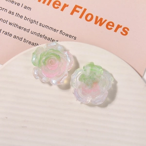 Detailed view of pearlescent resin blue rose charms with glitter for DIY hair accessories