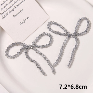 Detailed view of handmade woven pearl bow shoe charms with size measurements 7.2x6.8cm