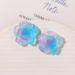 Detail of translucent blue-purple gradient resin rose with glitter for DIY shoe charms