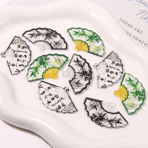 Detail of acrylic fan charms with bamboo ink painting and calligraphy for DIY jewelry