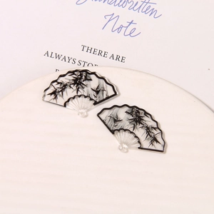 Macro detail of ink bamboo style fan shaped acrylic charms for DIY jewelry making