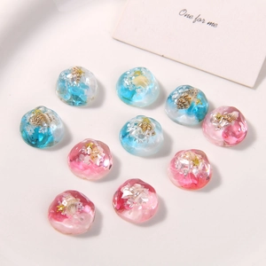 Detailed macro view of gradient resin shoe charms with shells and star sequins