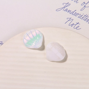 Macro detail of iridescent shell charms for DIY accessories and decorative shoe buckles
