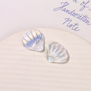 Macro shot of iridescent pearlescent shell charms with radiant texture for DIY crafts