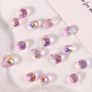 Macro shot of pink aurora AB faceted teardrop glass beads for DIY jewelry making