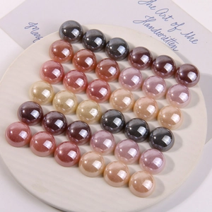 Detailed view of colorful glossy faux pearl cabochons for DIY jewelry and accessories