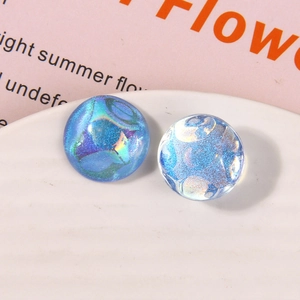 Macro shot of blue starry glitter resin cabochons for DIY earring and jewelry making