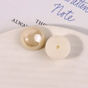 Macro shot of cream faux pearl acrylic resin flatback beads for DIY jewelry making