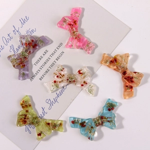 Set of 6 colorful resin bow accessories with embedded dried flowers and pearls