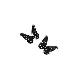 Pair of minimalist black acetate butterfly charms with white polka dots for DIY hair accessories