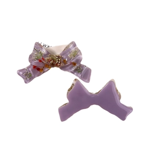 Charming purple resin bow hair clips set with embedded dried flowers on white background