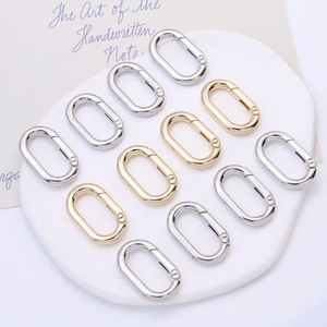 Polished oval alloy spring gate carabiners in gold and silver for DIY keychains and bags