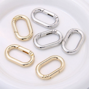 Oval alloy spring snap hooks in gold and silver finish for keychains and bags