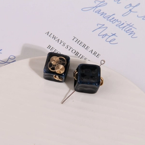 Steampunk style dark blue resin cube charms with gold gears for DIY jewelry making