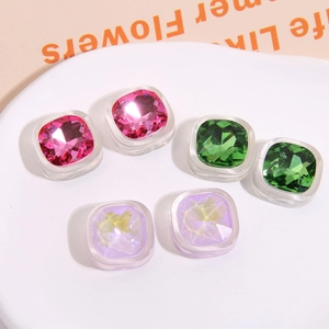Macro shot of colorful square faceted resin gems with iridescent finish for DIY crafts