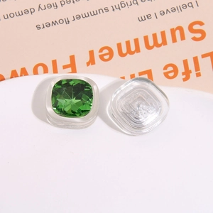 Detailed macro view of square green crystal resin patches for DIY jewelry making