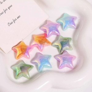 Close-up of iridescent gradient resin star charms for DIY earrings and jewelry making