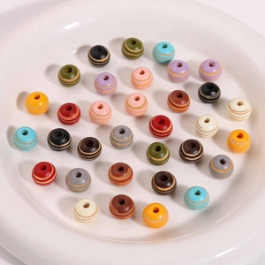 Detailed view of 10mm colorful ribbed wooden beads for DIY jewelry making and crafts
