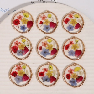Handmade gold alloy resin pendants with colorful dried flowers in 3x3 grid display