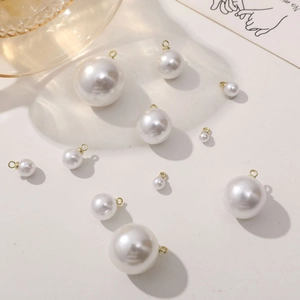 White imitation pearl charms with gold loops for DIY jewelry making in various sizes